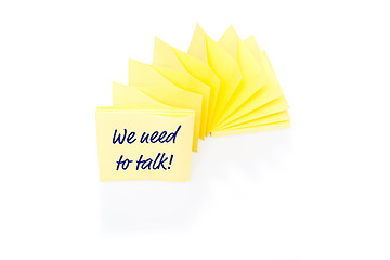 Image showing Yellow sticky note on block with message We Need To Talk