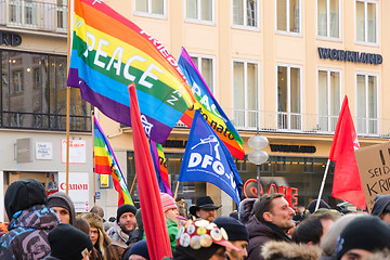 Image showing European peaceful march with flags placards and banners