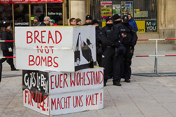 Image showing Police cordon and signs banners on protest rally anti-NATO demon