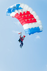 Image showing Paratrooper girl descends