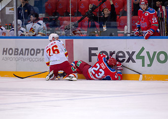 Image showing E. Sallinen (76) and A. Stas (23) fall down