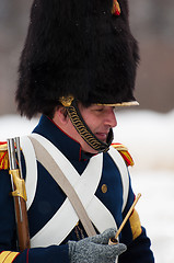 Image showing Smoking russian musketeer with pipe