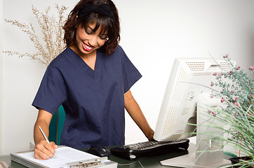 Image showing Health Care Worker Takes Medical Notes Nursing Intern Clipboard