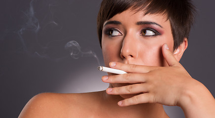 Image showing Young Woman Inhales Cigarette Smoke INtimate Smoker Portrait