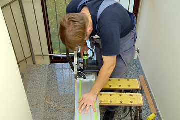 Image showing carpenter and saw