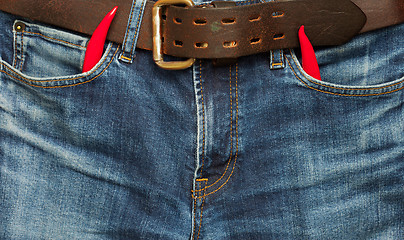 Image showing old jeans with red chili pepper 