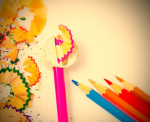 Image showing set of colored pencils, sharpener and shavings