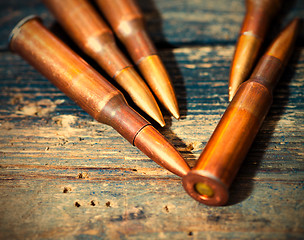 Image showing Still life with five rifle cartridges