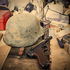 Image showing Parabellum and vintage German soldier helmet