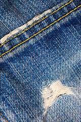 Image showing frayed blue jeans