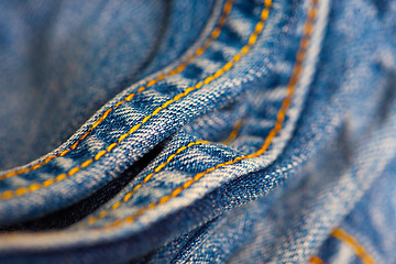 Image showing Jeans with yellow stitching thread