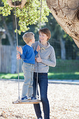 Image showing family at swings