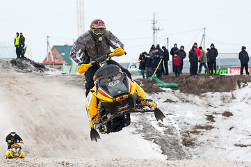 Image showing Jump of sportsman on snowmobile