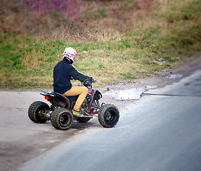 Image showing Young man on a quad