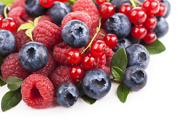 Image showing Many blueberries, raspberries. Isolated white