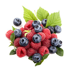 Image showing Many blueberries, raspberries. Isolated white