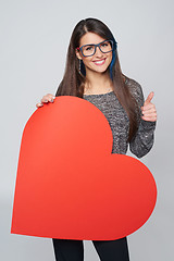 Image showing Woman holding big heart shape