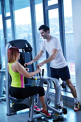 Image showing woman exercising with her personal trainer