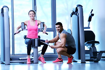 Image showing woman exercising with her personal trainer