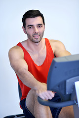 Image showing man running on the treadmill