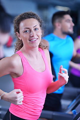 Image showing woman exercising on treadmill in gym