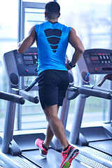 Image showing man running on the treadmill