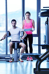 Image showing woman exercising with her personal trainer