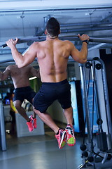 Image showing handsome man exercising at the gym