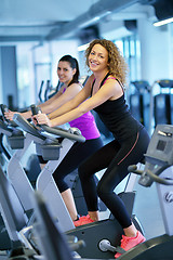 Image showing Group of people running on treadmills