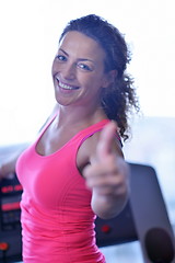 Image showing woman exercising on treadmill in gym