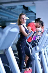 Image showing woman exercising on treadmill in gym