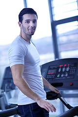 Image showing man running on the treadmill