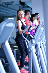 Image showing woman exercising on treadmill in gym