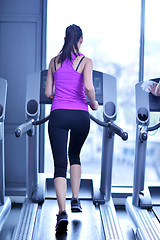 Image showing woman exercising on treadmill in gym