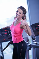 Image showing woman exercising on treadmill in gym