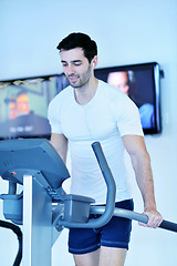 Image showing man running on the treadmill