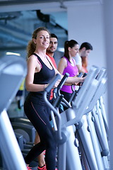 Image showing woman exercising on treadmill in gym