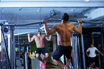 Image showing handsome man exercising at the gym