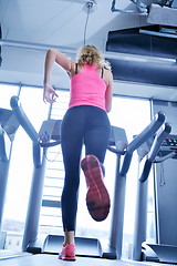 Image showing woman exercising on treadmill in gym