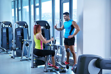 Image showing woman exercising with her personal trainer