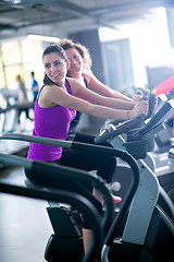 Image showing Group of people running on treadmills