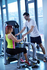 Image showing woman exercising with her personal trainer