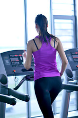 Image showing woman exercising on treadmill in gym