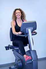 Image showing woman exercising on treadmill in gym