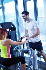 Image showing woman exercising with her personal trainer