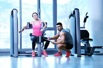 Image showing woman exercising with her personal trainer