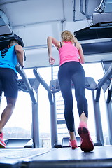 Image showing woman exercising on treadmill in gym