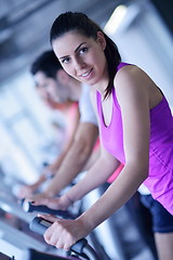 Image showing woman exercising on treadmill in gym