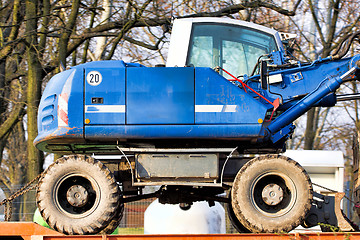 Image showing  Digger-loader on a trailer