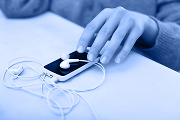 Image showing Smartphone with earphones